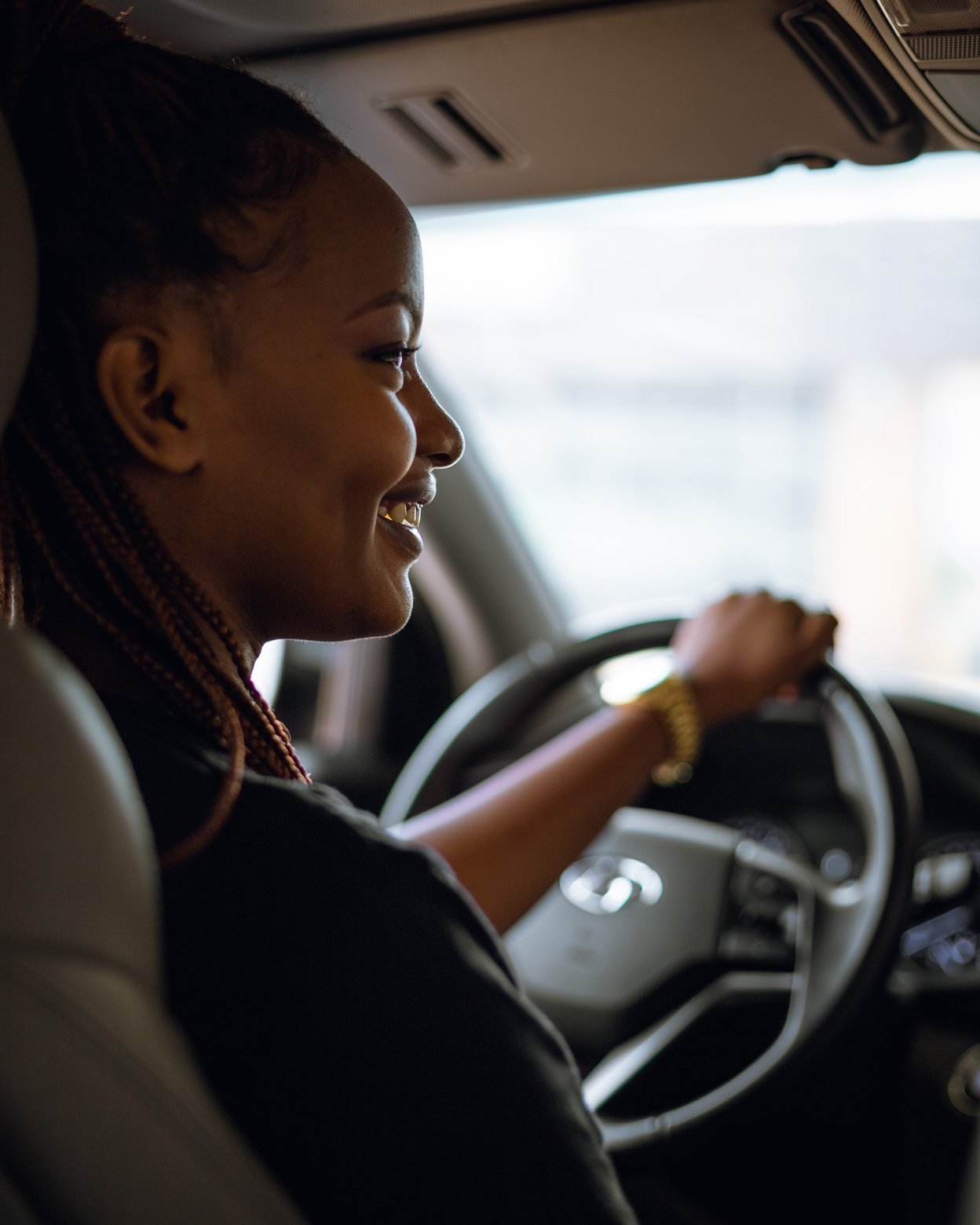 Woman in Black Jacket Driving Car